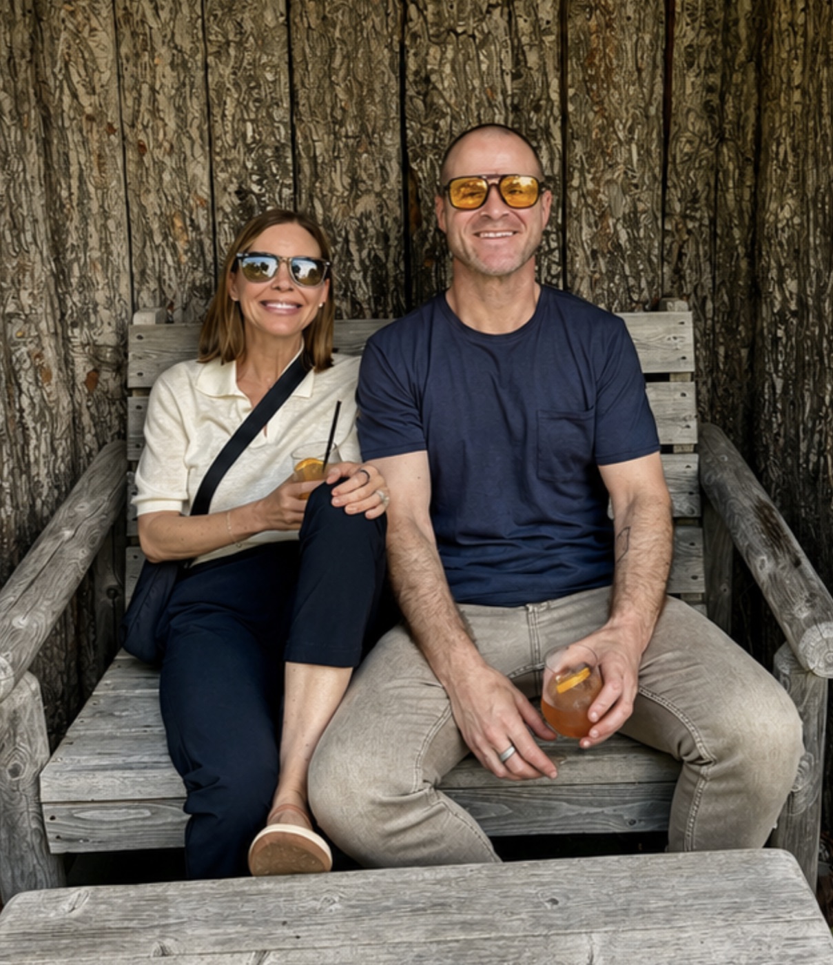 Justin and Jennifer Welsh sitting together outdoors